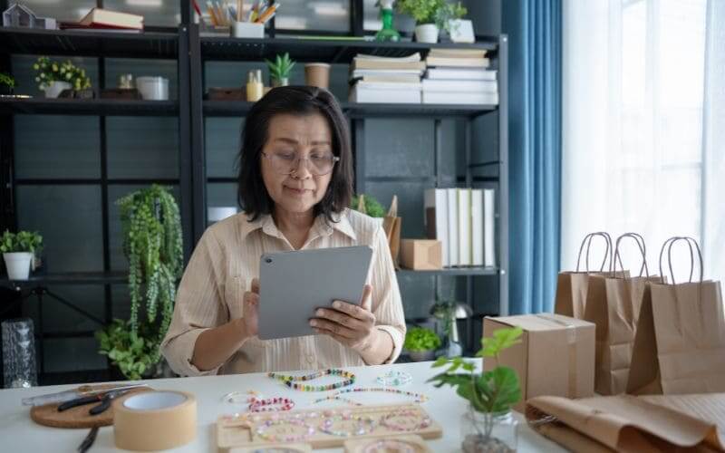 Wealthlink Inc. | What SMEs Need to Build a Strong Workforce in the Philippines Wealthlink Inc. | small-business-owner-inventory-management-tablet